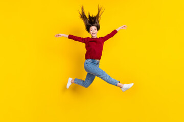 Fototapeta na wymiar Full length body size view of pretty funky cheerful carefree girl jumping having fun isolated over bright yellow color background