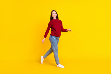 Fototapeta na wymiar Full body photo of cool young lady go wear sweater jeans isolated on vivid yellow color background
