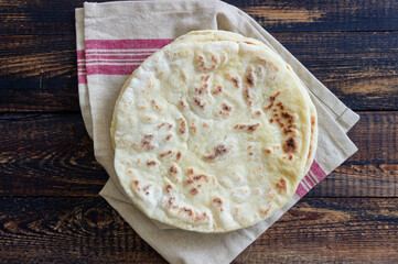 Pita bread on a wooden background. National cuisine. Healthy eating. Vegetarian food.
