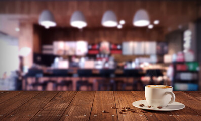 A Cup of hot coffee latte on table in cafe with shallow depth of field