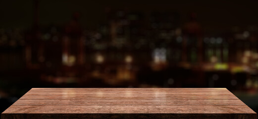 Empty wooden table top with lights bokeh on blur cityscape background.