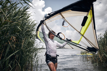 Windsurfer surfing on a windy summertime day at the river.