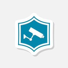 Shield with camera symbol isolated on gray background