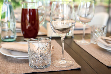 Empty wine glasses are on the table. A fragment of the serving.