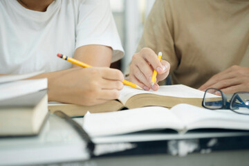 Young students campus helps friend catching up and learning.