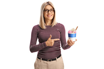 Young woman holding ice cream in a paper cup and pointing