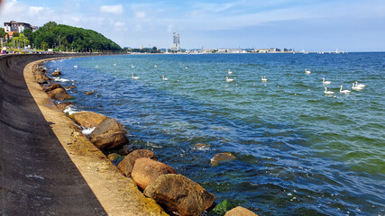 Beautiful color of water in the bay by the breakwater in the seaside city of Gdynia. Gdynia is an important seaport of the Baltic Sea in Poland.