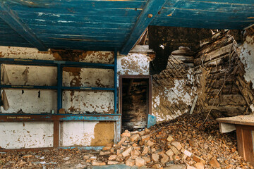 Abandoned Ruined Old Wooden Village House In Chernobyl Resettlement Zone. Belarus. Chornobyl Catastrophe Disasters. Dilapidated House In Belarusian Village. Whole Villages Must Be Disposed