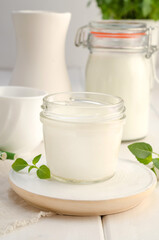 Dairy starter culture for the preparation of fermented milk products, yogurt, kefir on a white wooden background