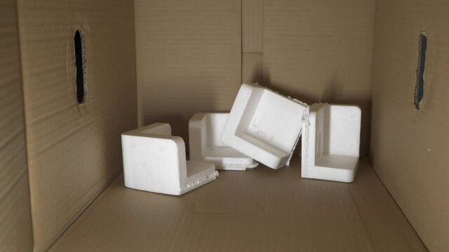 EPS foam in a cardboard box. Expanded Polystyrene foam is a product of styrene monomer.