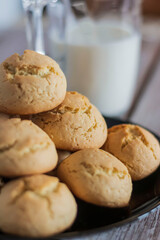 
There is a bowl of delicious cookies on the table.