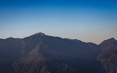 mountain peak with bright blue sky at morning from flat angle