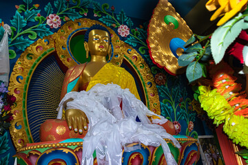buddha golden statue close up shot at monastery from different perspective