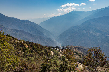 mountain valley at morning with blue sky and mountain village