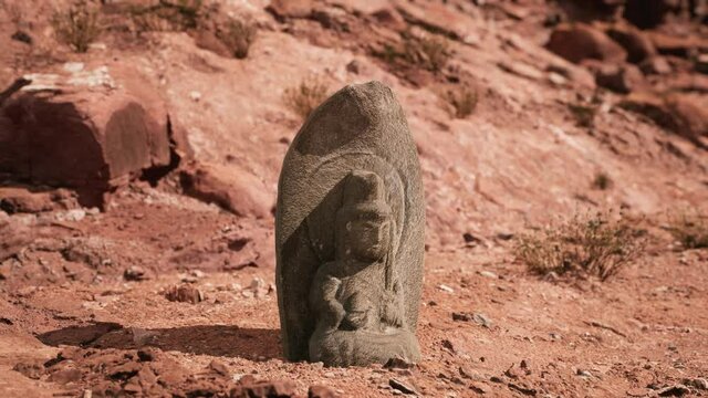 Ancient Statue on the Rocks Desert