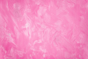 Wood planks brushed with bright pink acrylic paint. Saturated color, art background,