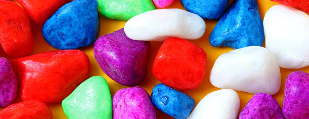 close-up colorful painted pebbles background