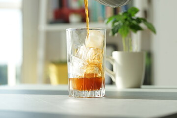 Iced coffee with ice in a tall glass