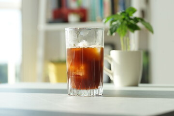 Iced coffee with ice in a tall glass