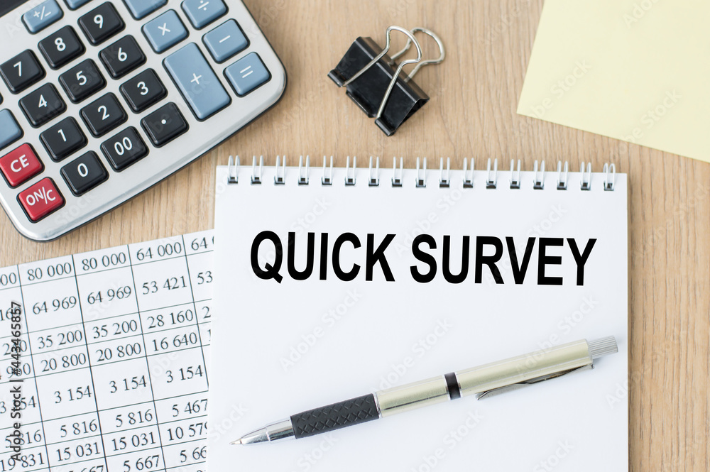 Poster quick survey text written on a notebook with pen