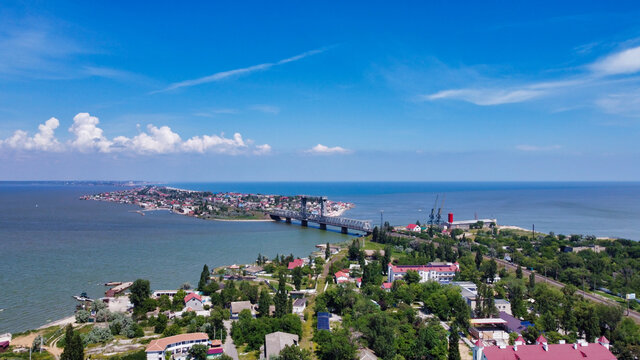 View of the Black Sea and railroad bridge. in Zatoka.  Houses on the peninsula and estuary. Ukraine. Europe