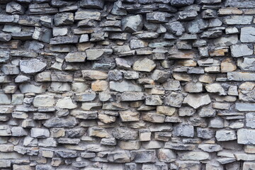 The texture of a stone wall. Old castle stone wall texture background. Stonewall as a background or texture. Part of a stone wall, for background or texture