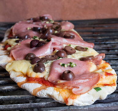 Grilled pizza with mozzarella. Homemade food concept. Time to enjoy with friends.