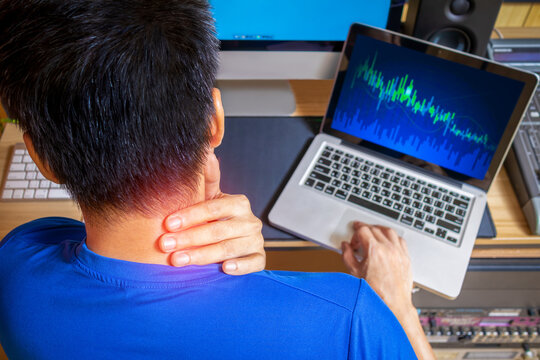 back of young business people are suffering from neck pain. Asian men stressful working with computer for a long time. office syndrome concept