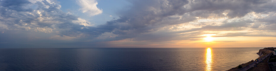 Naklejka na ściany i meble Ultra widescreen panorama of the skyline, sunrise sunset on the black sea