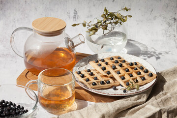 Homemade belgian waffles with berries and tea