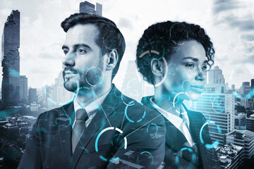 Businessman and businesswoman as a part of corporate team pondering about technology as a business necessity for tremendous growth in commerce. Tech hologram icons over Bangkok background.