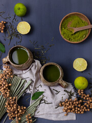 Obraz na płótnie Canvas matcha green tea in ceramic cups top view