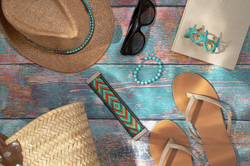 Fashion casual woman summer  clothes and accessories collection. Summer set for beach. Beach background.Flat lay.