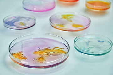 Petri dishes with colorful media for bacteria.