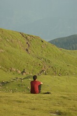 Fototapeta na wymiar Candid shot of a young male model relaxing and admiring the beauty of Azad Kashmir