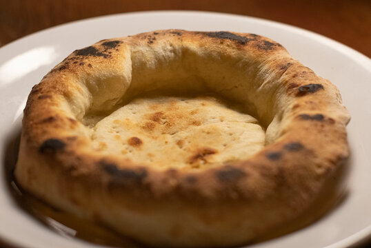 rustic pizza dough with edges