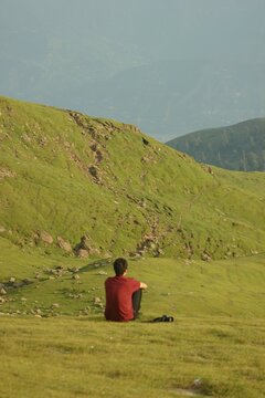 Candid shot of a young male model relaxing and admiring the beauty of Azad Kashmir