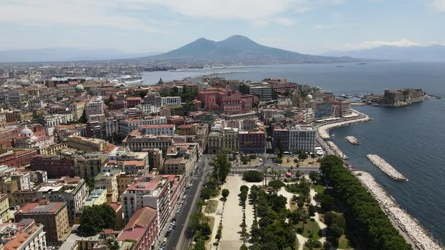 TOP 4K view of Naples. Drone flight over the Italian city of Naples overlooking the sea, castel dell'ovo  and Mount Vesuvius. Italy Naples July 2021