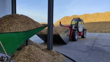 Fototapeta na wymiar Wood chips are fuel for green electricity generation. Alternative energy. Environmental Protection