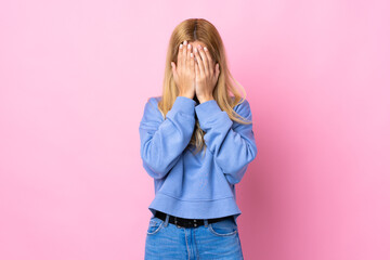 Young Uruguayan blonde woman over isolated pink background covering eyes by hands