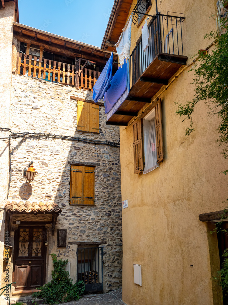 Sticker classic mountain village houses in small French Alps village Saint Sauveur sur Tinee