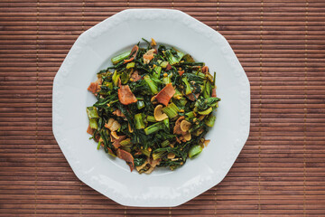 Top view of cabbage greens and ham stir fry.