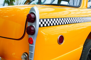 Details of the rear of an old yellow cab of New York.