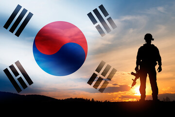 Silhouette of a soldiers against the sunrise. Concept - protection, patriotism. Armed forces of...