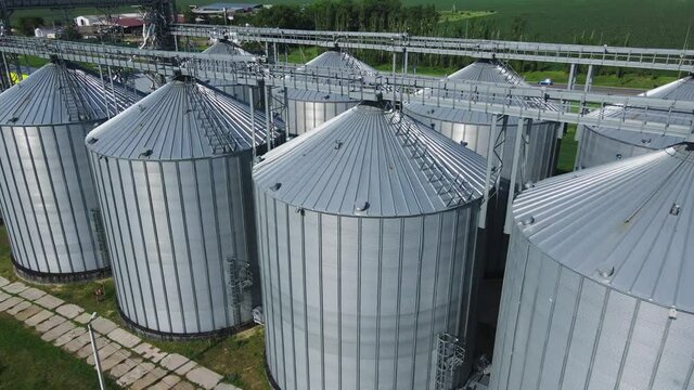 Silo system tanks, grain bin and elevator. Grain storage in large slots aerial view