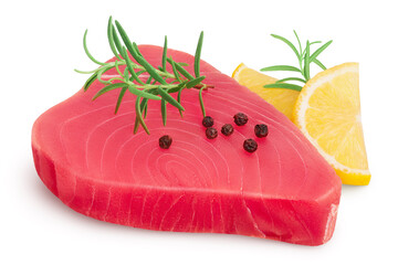 Fresh tuna fish fillet steak with rosemary, lemon and peppercorns isolated on white background with clipping path and full depth of field