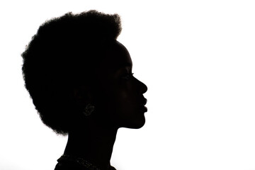 Close up profile silhouette portrait of african american black woman on white studio background.