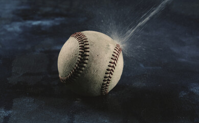 Water on baseball for rain concept in sport.