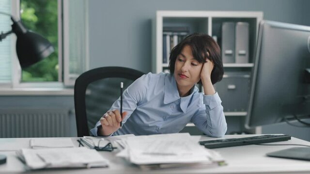 Woman wasting time at work