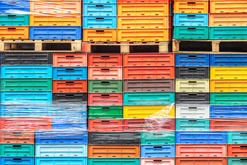 Colored plastic boxes stacked in a fishing port